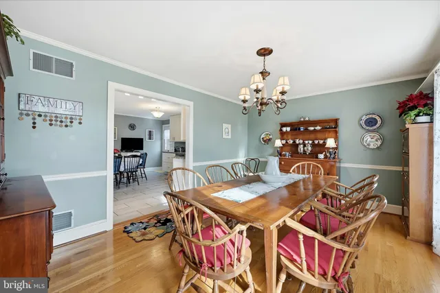 a kitchen with stainless steel appliances kitchen island granite countertop a refrigerator and a stove top oven