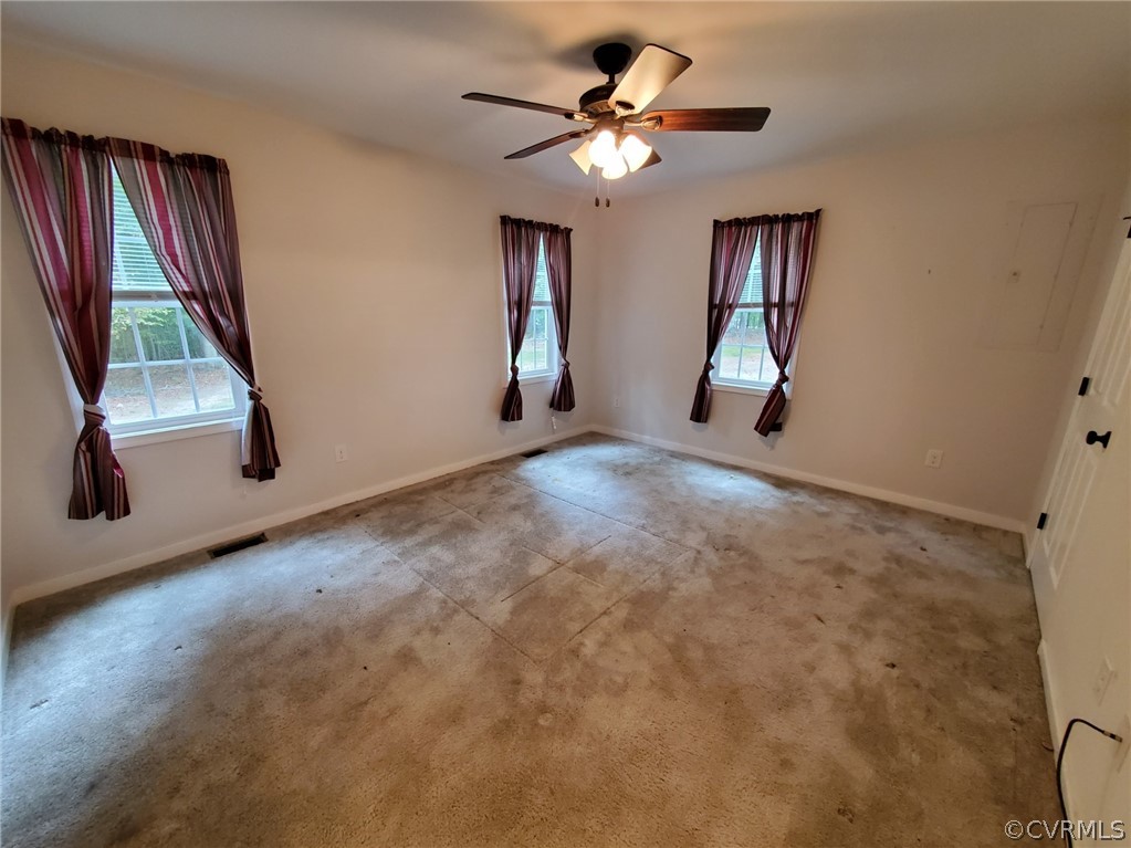 10140 Reed Rock Road Amelia Court House, VA 23002 - Photo 17 of 27 wooden floor in an empty room with a window