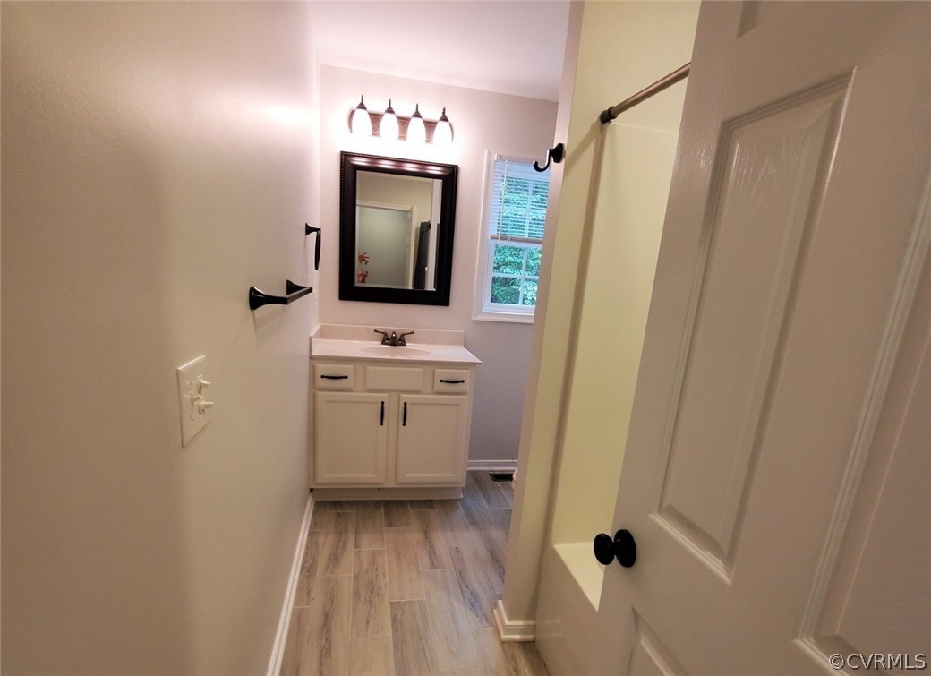 10140 Reed Rock Road Amelia Court House, VA 23002 - Photo 24 of 27 a bathroom with a sink a toilet and a mirror