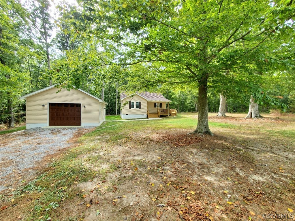 10140 Reed Rock Road Amelia Court House, VA 23002 - Photo 6 of 27 a house with trees in front of it