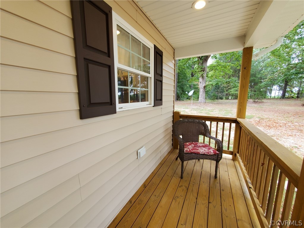 10140 Reed Rock Road Amelia Court House, VA 23002 - Photo 8 of 27 a view of balcony with wooden floor and outdoor seating
