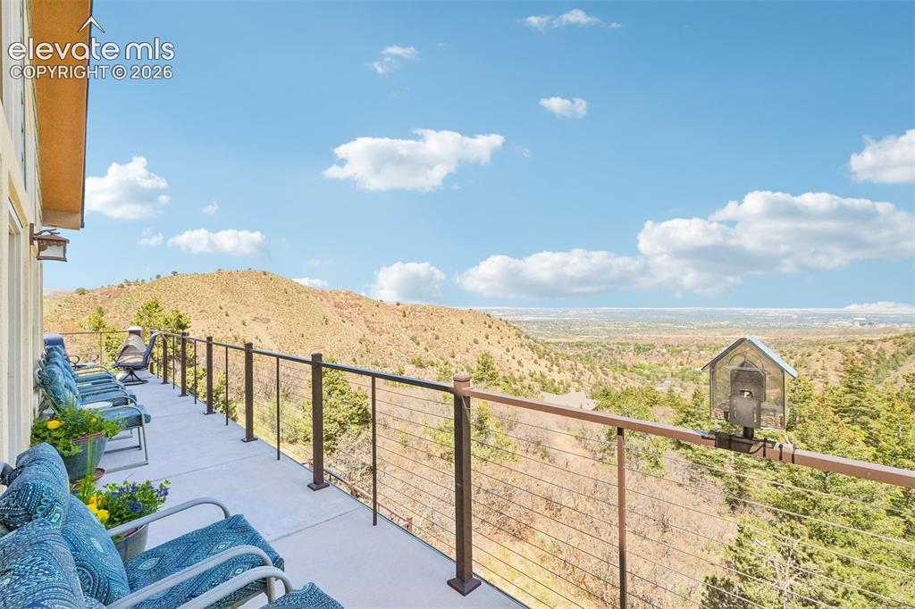 858 Oak Ridge Road Manitou Springs, CO 80829 - Photo 14 of 50 Walk out wrap around concrete deck off the living room. Just look at those views!