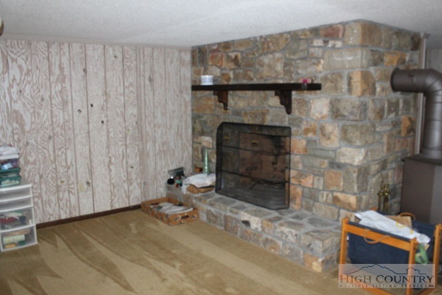 372 Heritage Ridge Road Boone, NC 28607 - Photo 19 of 34 a room with a fireplace