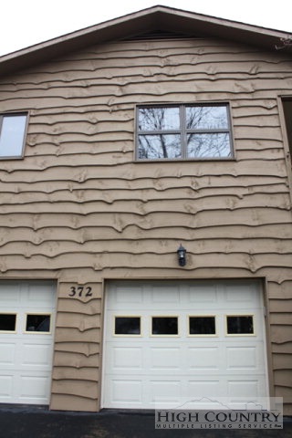 372 Heritage Ridge Road Boone, NC 28607 - Photo 2 of 34 a white building with a window