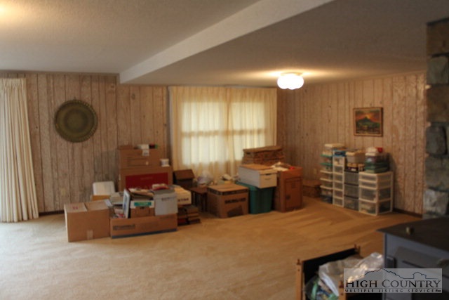 372 Heritage Ridge Road Boone, NC 28607 - Photo 21 of 34 a living room with furniture a window and a table