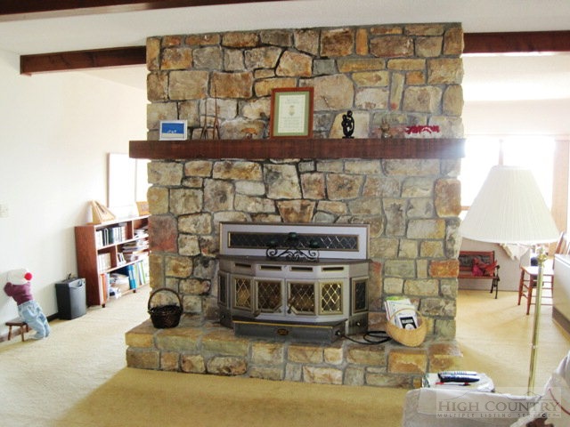 372 Heritage Ridge Road Boone, NC 28607 - Photo 28 of 34 a living room with fireplace