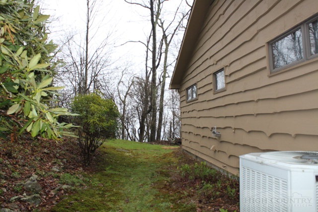 372 Heritage Ridge Road Boone, NC 28607 - Photo 32 of 34 a view of backyard with wooden fence and large trees