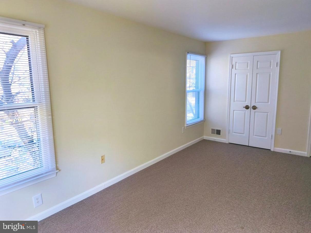 12452 Sweet Leaf Terrace Fairfax, VA 22033 - Photo 17 of 38 an empty room with windows