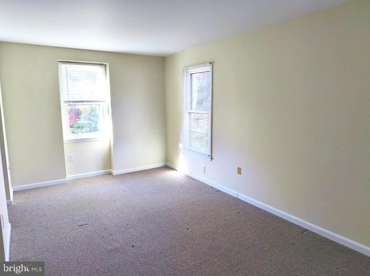 12452 Sweet Leaf Terrace Fairfax, VA 22033 - Photo 19 of 38 an empty room with windows
