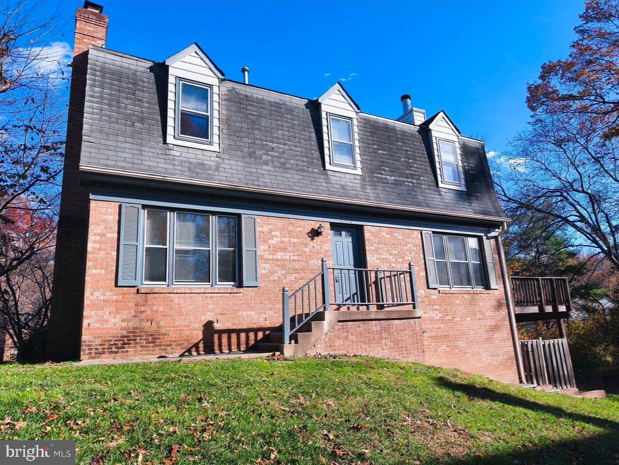 12452 Sweet Leaf Terrace Fairfax, VA 22033 - Photo 2 of 38 a front view of a house with a yard