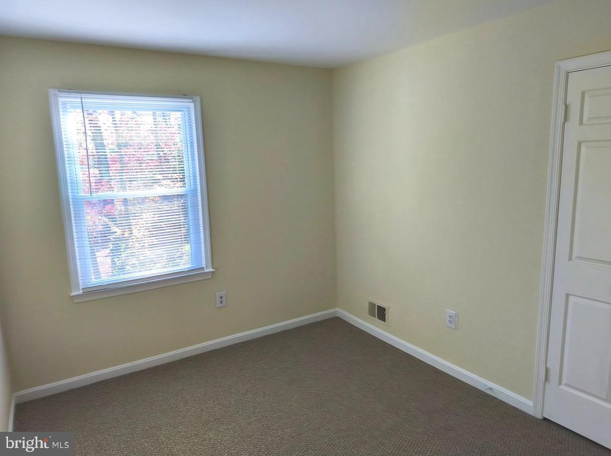 12452 Sweet Leaf Terrace Fairfax, VA 22033 - Photo 25 of 38 an empty room with a window