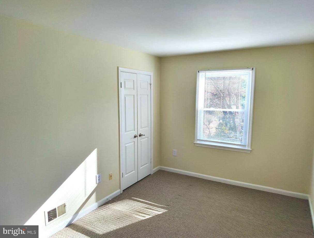 12452 Sweet Leaf Terrace Fairfax, VA 22033 - Photo 27 of 38 a view of an empty room with a window