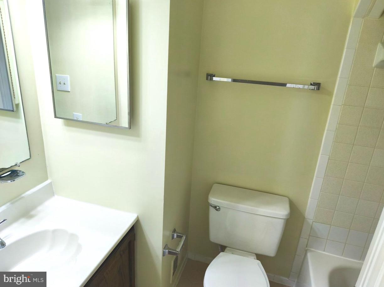 12452 Sweet Leaf Terrace Fairfax, VA 22033 - Photo 28 of 38 a bathroom with a toilet and a sink