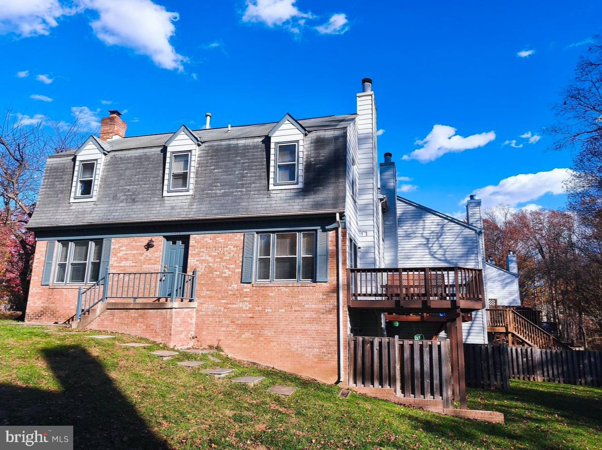 12452 Sweet Leaf Terrace Fairfax, VA 22033 - Photo 3 of 38 a view of a house with iron fence