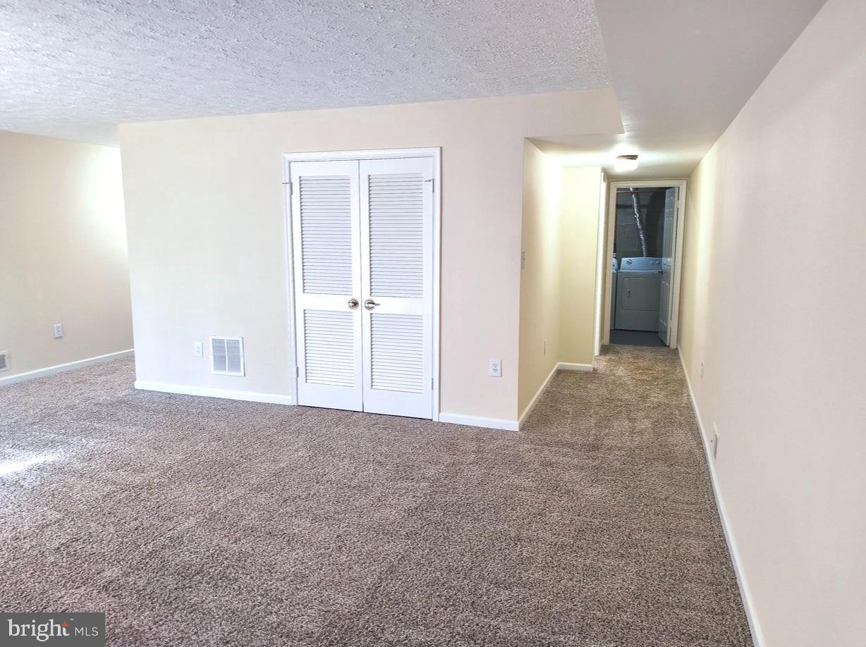 12452 Sweet Leaf Terrace Fairfax, VA 22033 - Photo 33 of 38 a view of a big room with closet and windows