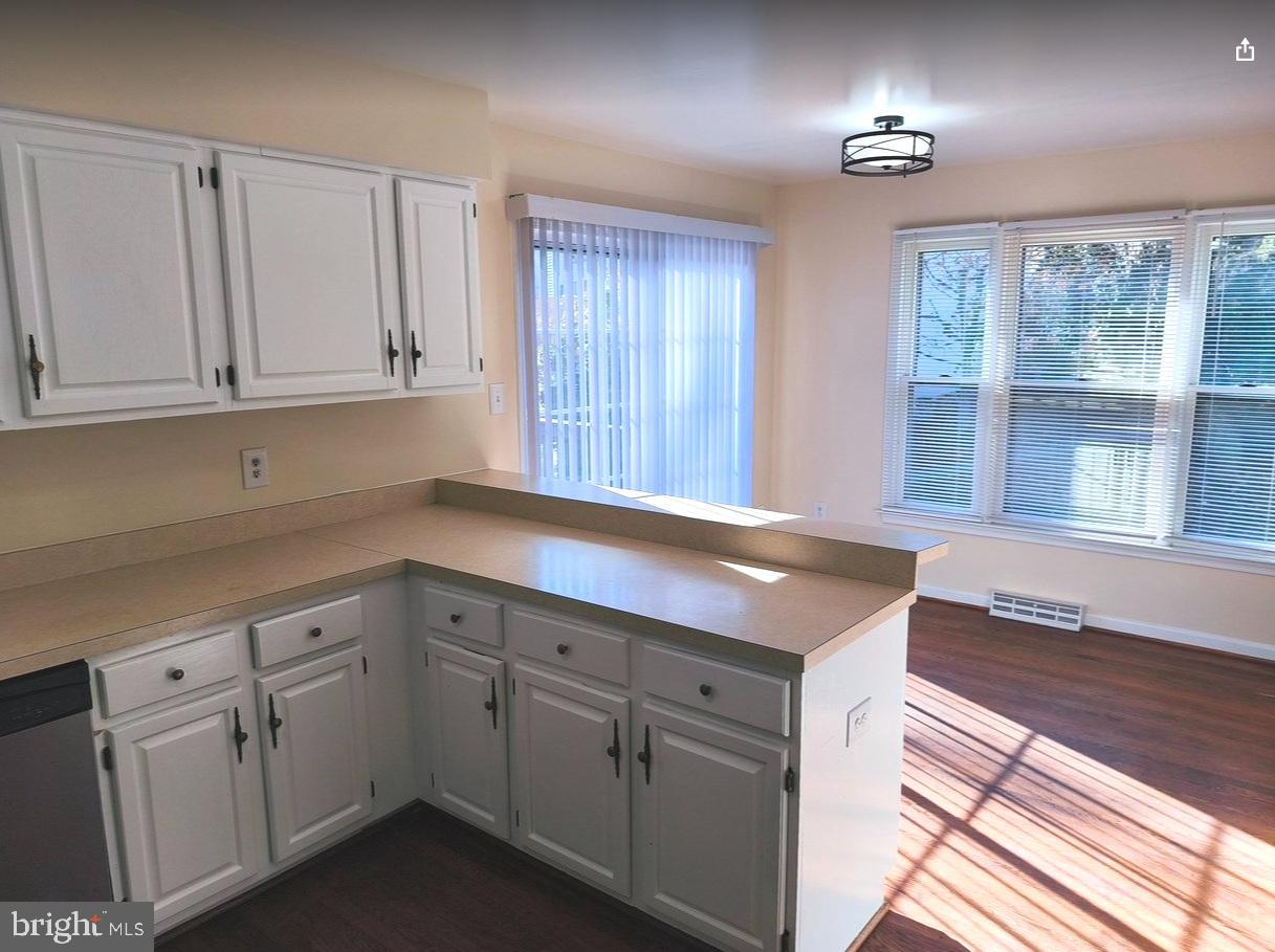 12452 Sweet Leaf Terrace Fairfax, VA 22033 - Photo 6 of 38 a kitchen with white cabinets and sink