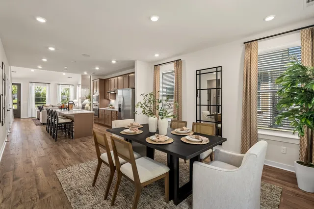 a view of a dining room with furniture and window