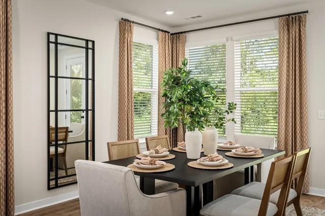 a view of a dining room with furniture window and outside view