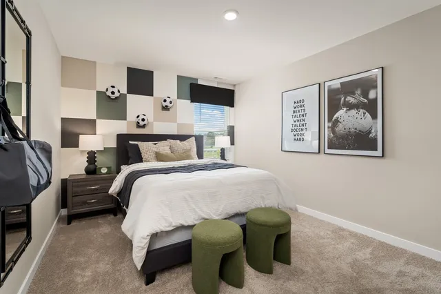 a bedroom with a bed and furniture