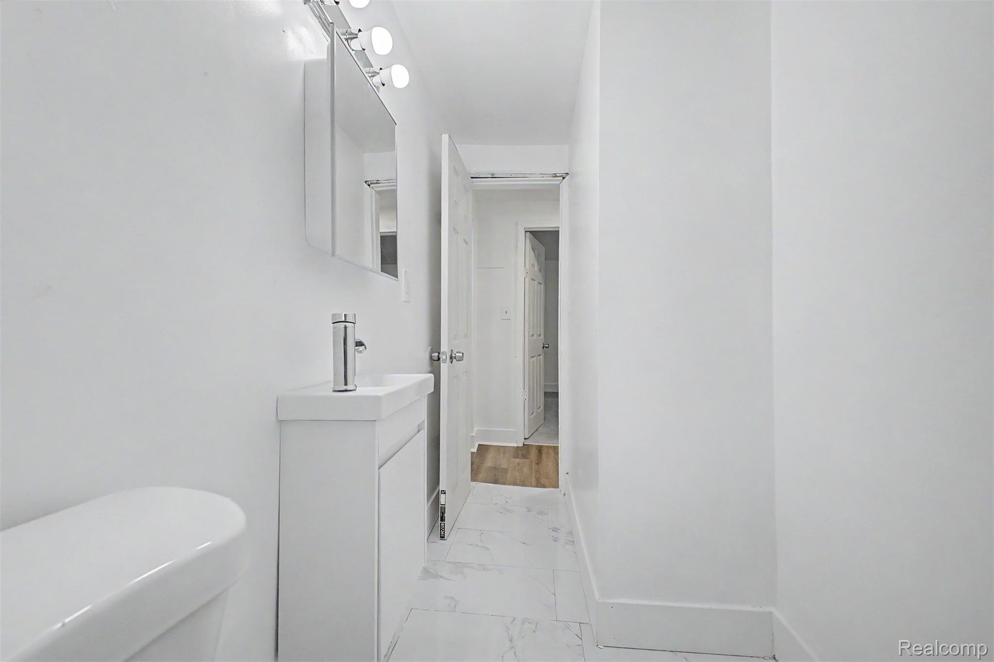 26718 Penn Street Inkster, MI 48141 - Photo 19 of 27 Bathroom featuring white walls and marble-look floor tiles