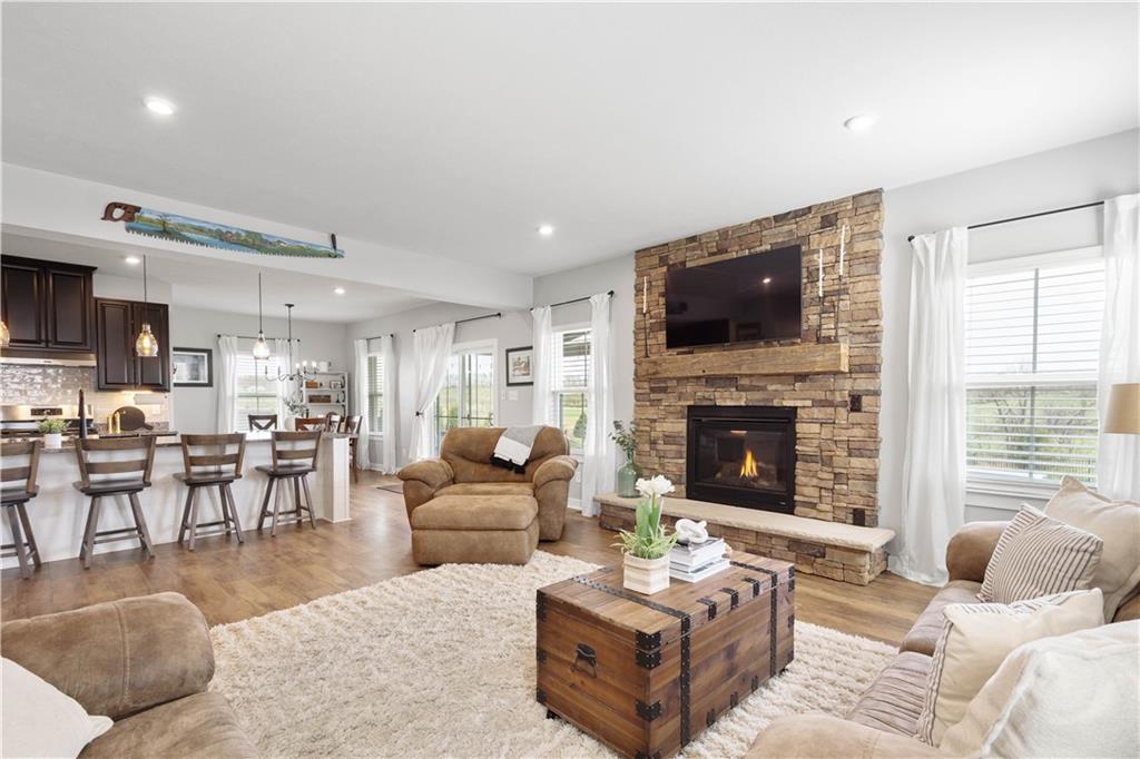 234 Regency Drive Eighty Four, PA 15330 - Photo 11 of 47 a living room with furniture a fireplace and a flat screen tv