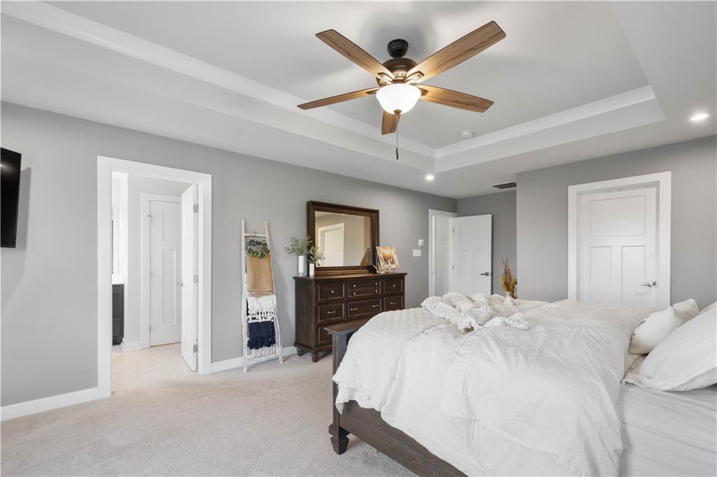 234 Regency Drive Eighty Four, PA 15330 - Photo 18 of 47 a bedroom with a large bed and a chandelier