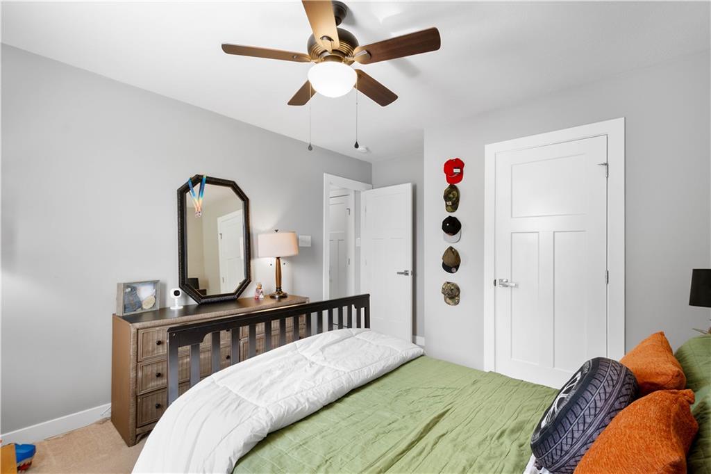 234 Regency Drive Eighty Four, PA 15330 - Photo 25 of 47 a bedroom with bed and a chandelier