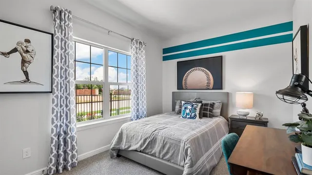 a bedroom with a bed and furniture