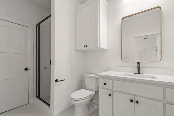 a bathroom with a sink toilet and vanity