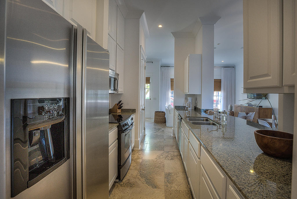 11 Atticus Road Rosemary Beach, FL 32461 - Photo 8 of 28 a kitchen with stainless steel appliances granite countertop a refrigerator and a sink