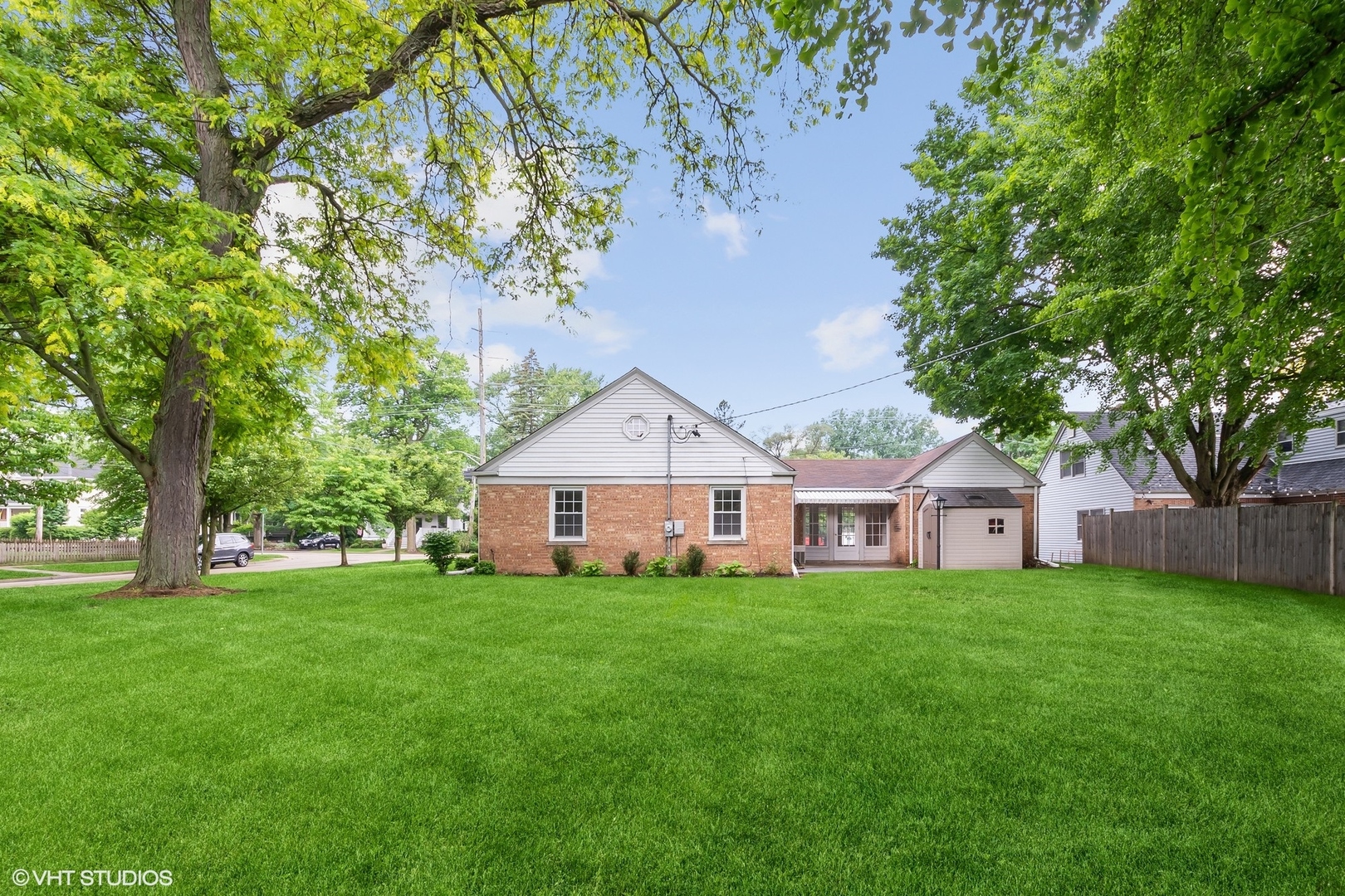 402 Berry Road Barrington, IL 60010 - Photo 17 of 22 a view of a house with a big yard and large trees