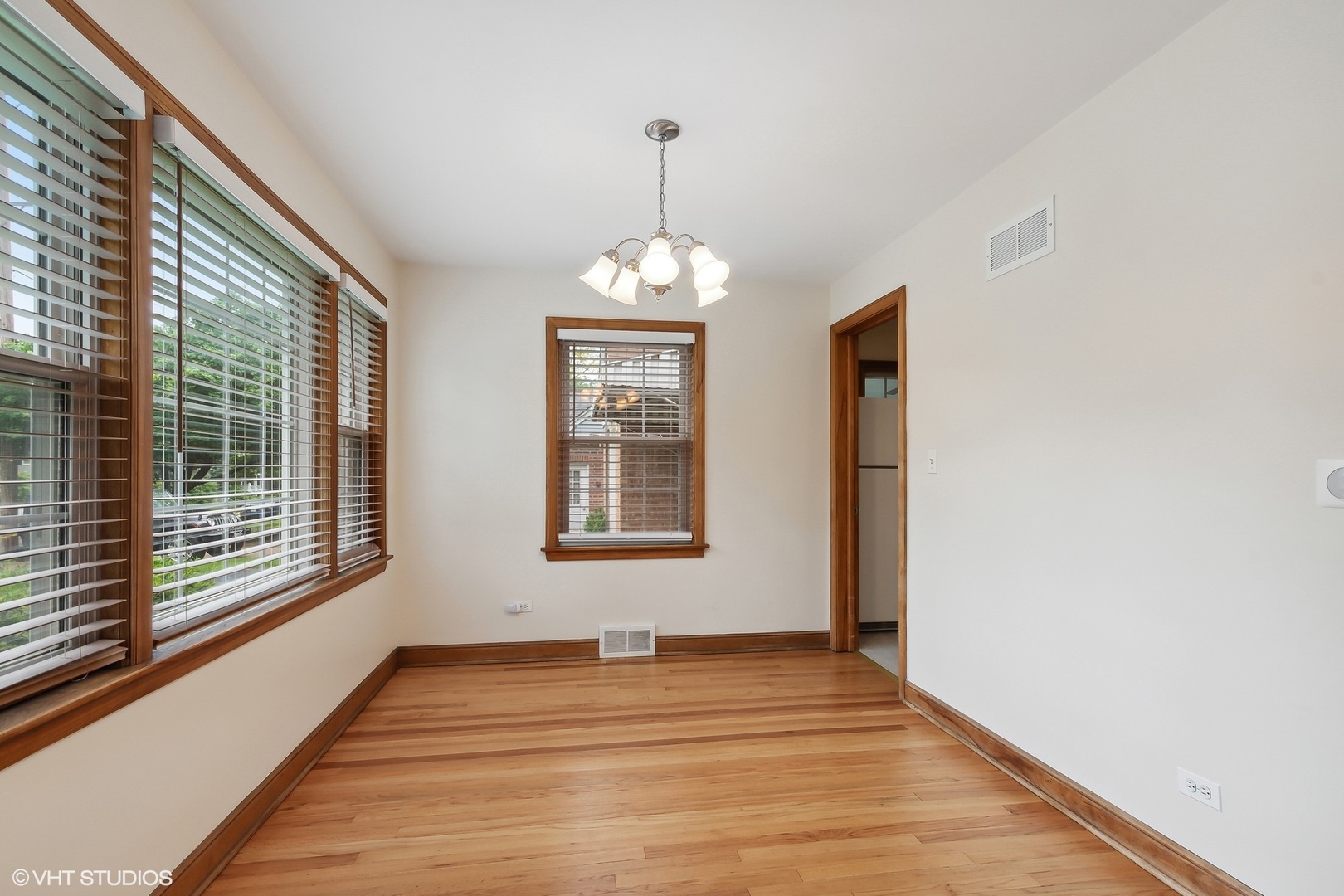402 Berry Road Barrington, IL 60010 - Photo 7 of 22 a view of an room with wooden floor and windows