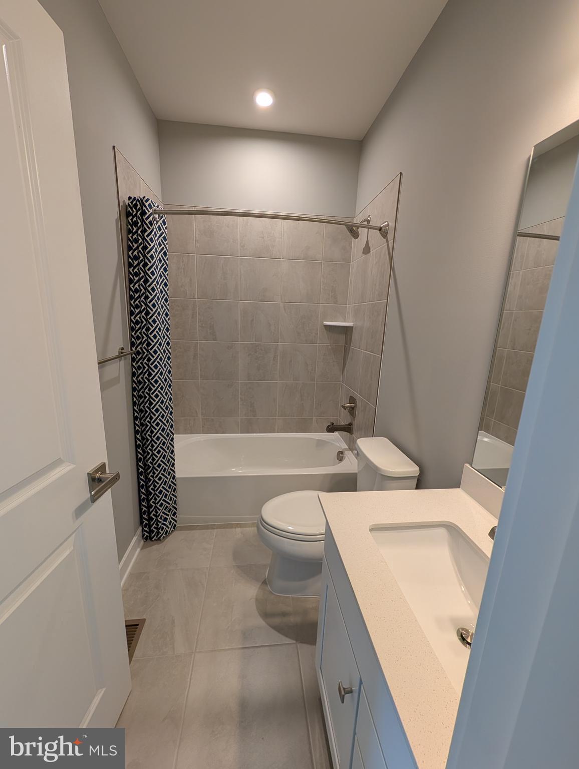 8445 Hamlin Street Lanham, MD 20706 - Photo 12 of 22 a bathroom with a sink a toilet and shower