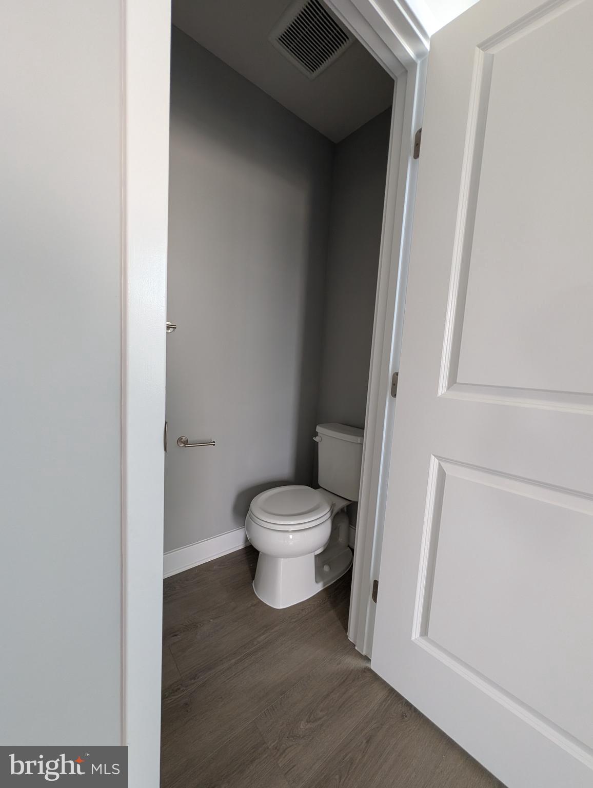 8445 Hamlin Street Lanham, MD 20706 - Photo 15 of 22 a bathroom with a toilet