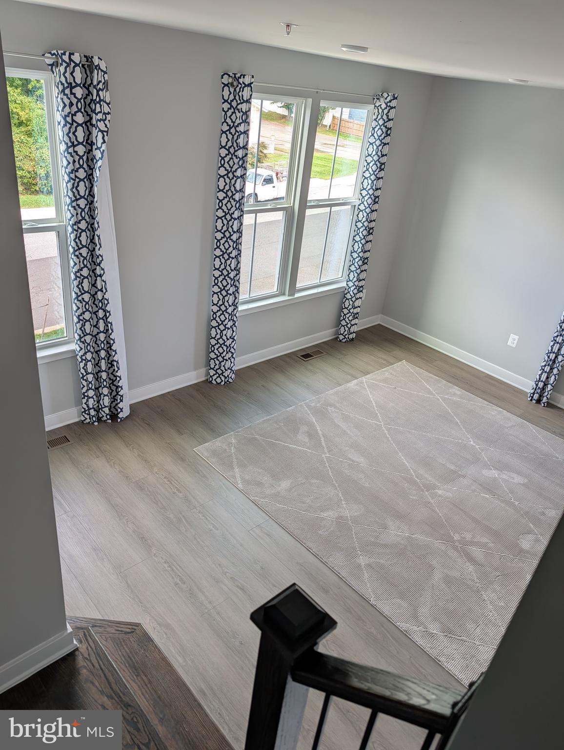 8445 Hamlin Street Lanham, MD 20706 - Photo 8 of 22 a view of an empty room with a window