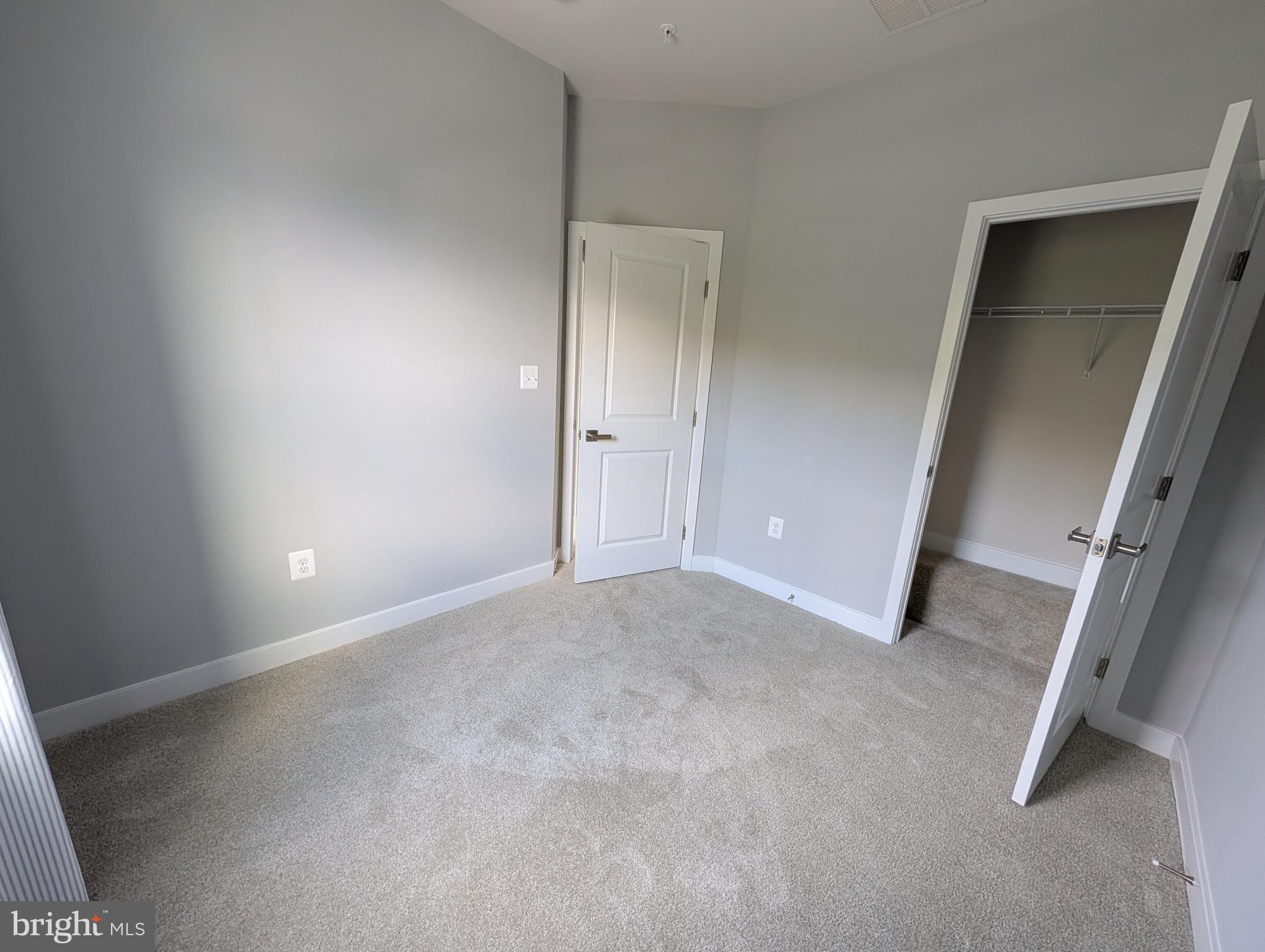 8445 Hamlin Street Lanham, MD 20706 - Photo 10 of 22 an empty room with windows