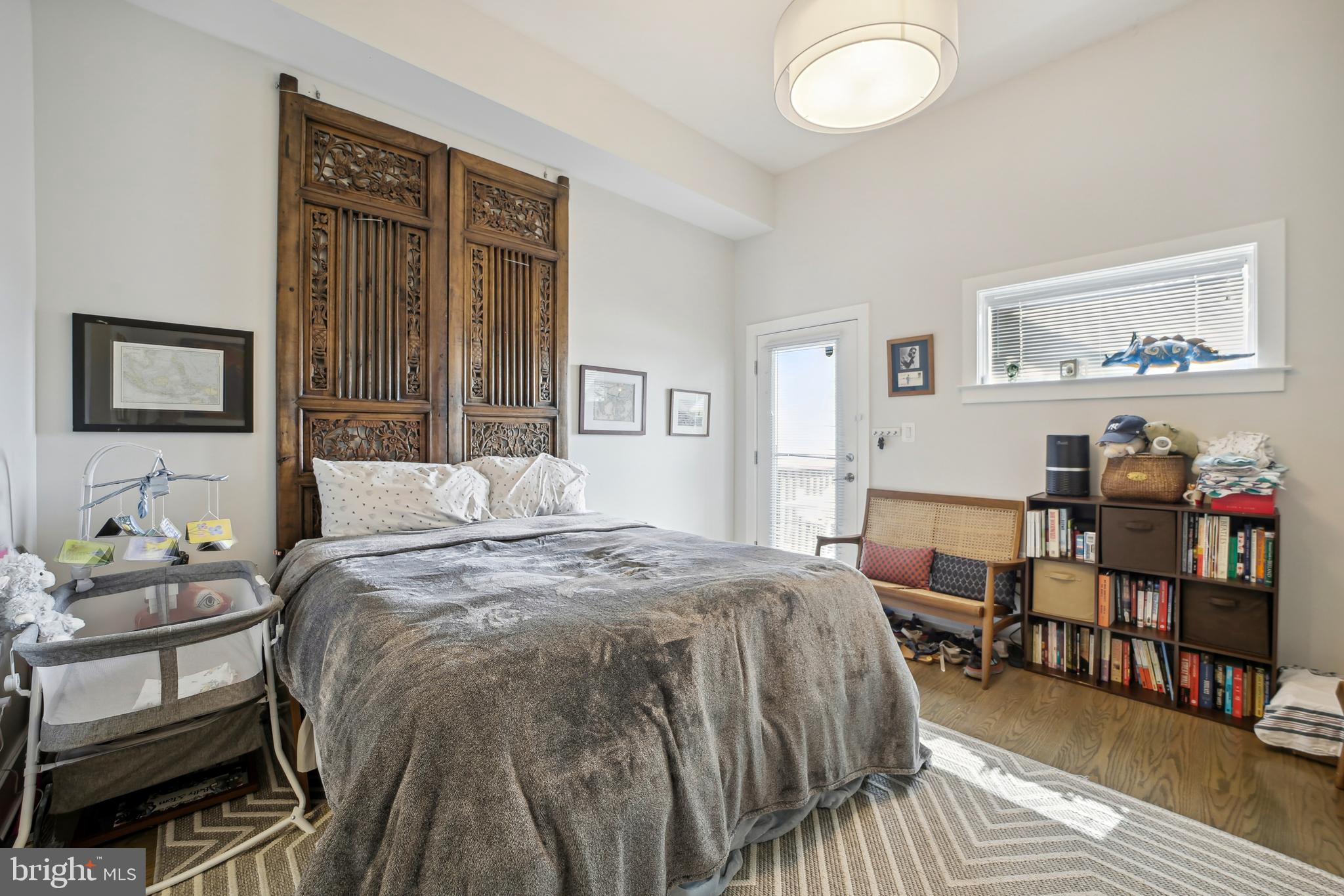 3815 14th Street Northwest, Unit 6 Washington, DC 20011 - Photo 6 of 15 a bed room with a bed and a chair