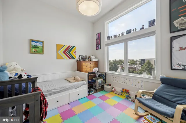 a bedroom with furniture and a window