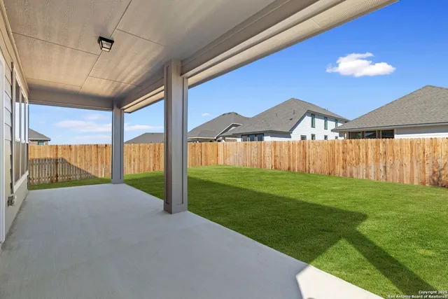 a view of a backyard of a house