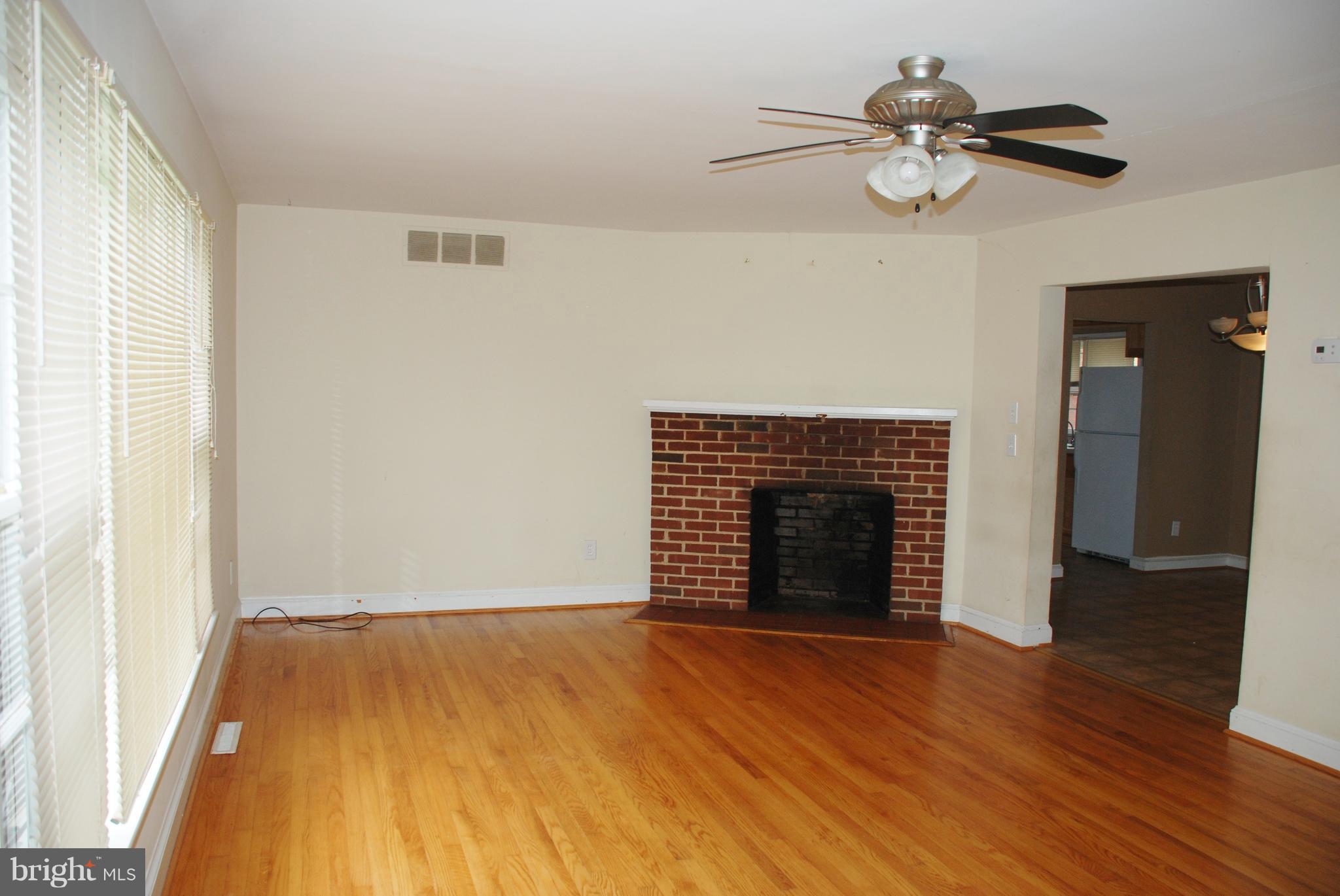 1002 North E St Extension Culpeper, VA 22701 - Photo 6 of 36 Living Room w/brick fireplace