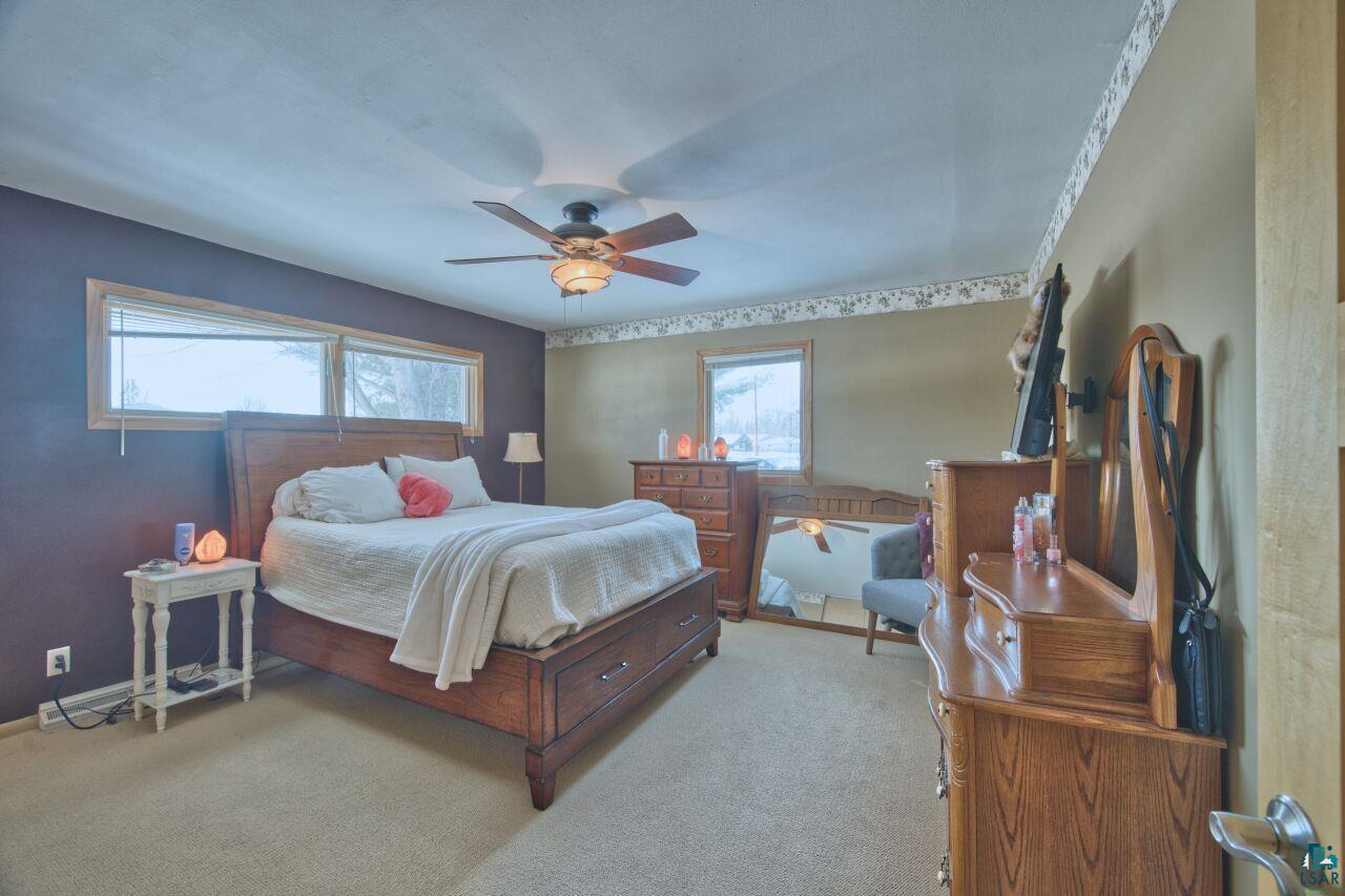 203 Wyandotte Road Hoyt Lakes, MN 55750 - Photo 16 of 39 Bedroom featuring light colored carpet and a ceiling fan