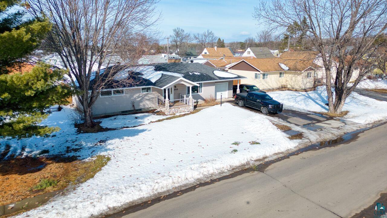 203 Wyandotte Road Hoyt Lakes, MN 55750 - Photo 37 of 44 View of front of house featuring covered porch and a residential view