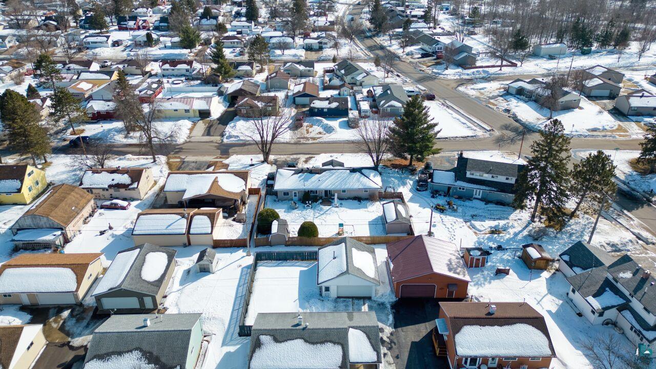 203 Wyandotte Road Hoyt Lakes, MN 55750 - Photo 44 of 44 Snowy aerial view with a residential view