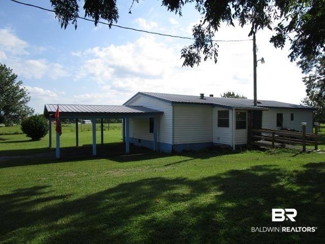 20705 Greek Cemetery Road Robertsdale, AL 36567 - Photo 2 of 25 Rear view of property with a lawn