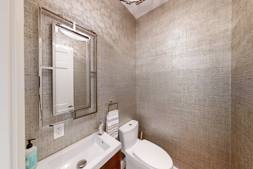 9 Chestnut Street Boston, MA 02108 - Photo 16 of 42 a bathroom with a toilet a sink and mirror