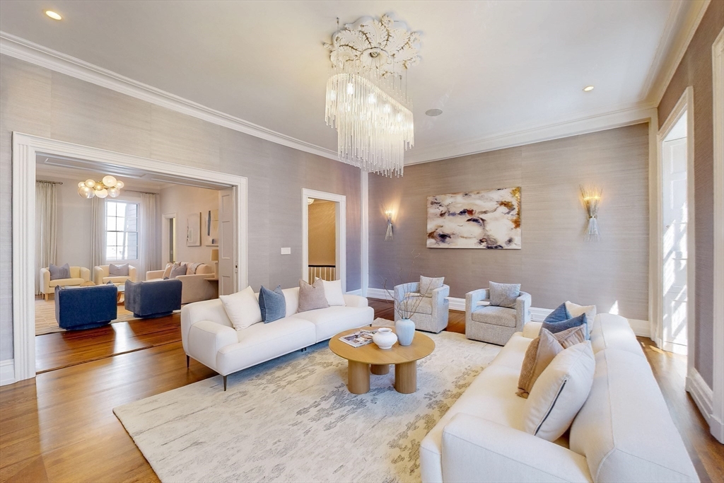 9 Chestnut Street Boston, MA 02108 - Photo 17 of 42 a living room with furniture and a chandelier