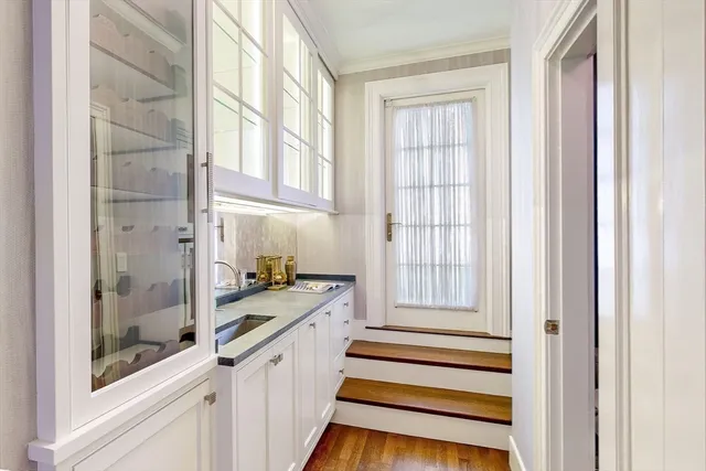 a view of a bathroom with a sink and windows