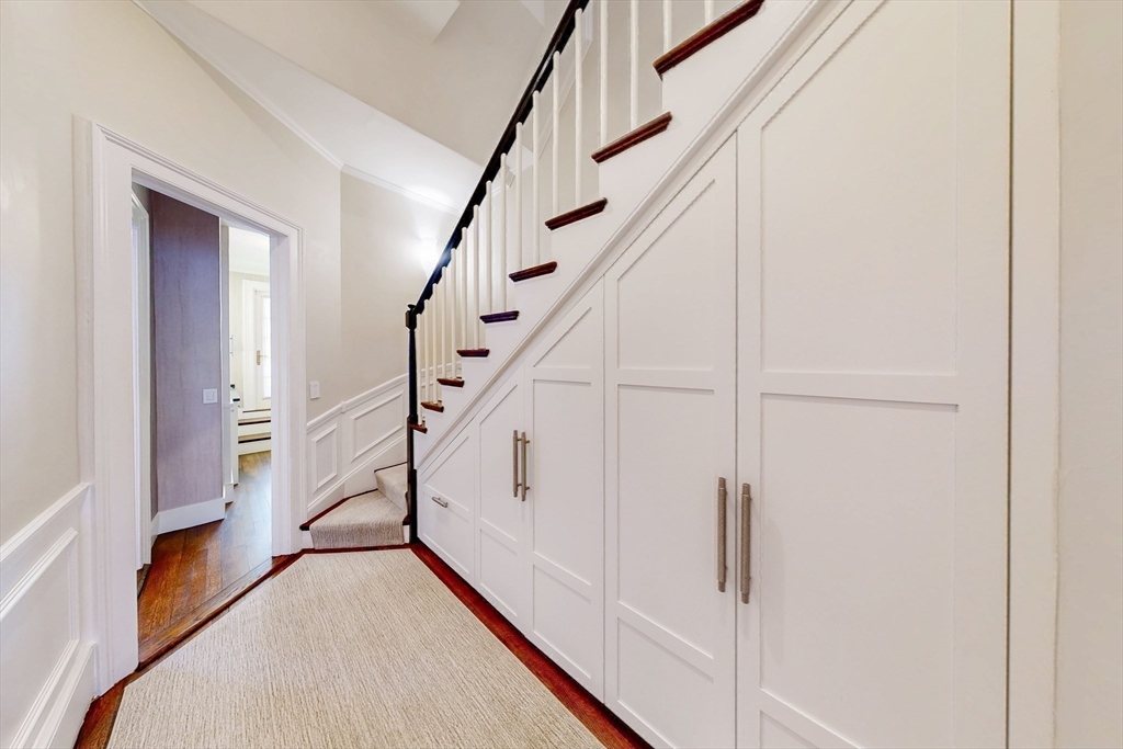 9 Chestnut Street Boston, MA 02108 - Photo 22 of 42 a view of staircase with wooden floor and white walls