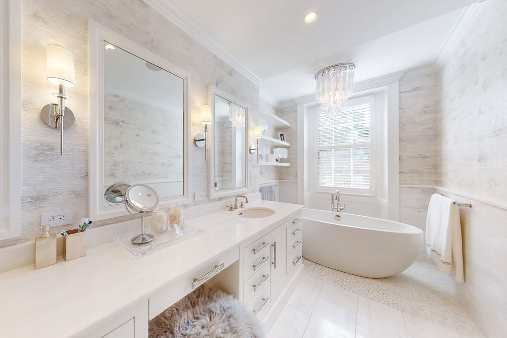 9 Chestnut Street Boston, MA 02108 - Photo 25 of 42 a bathroom with a double vanity sink double mirror and bathtub