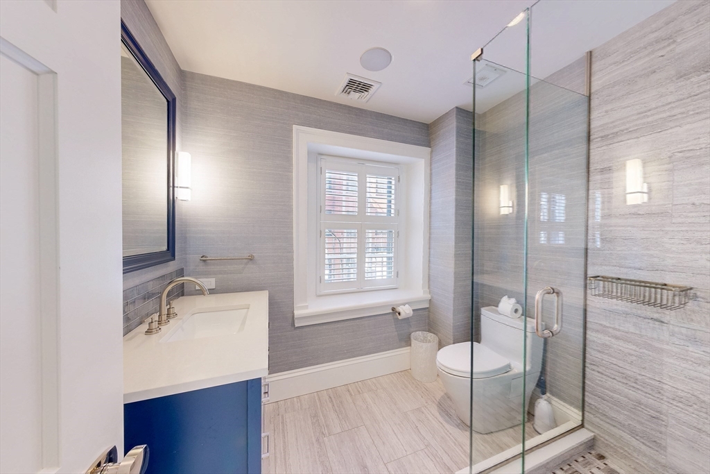 9 Chestnut Street Boston, MA 02108 - Photo 28 of 42 a bathroom with a tub sink and mirror